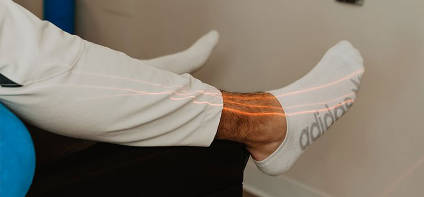 patient receiving class iv laser therapy to relieve elbow pain